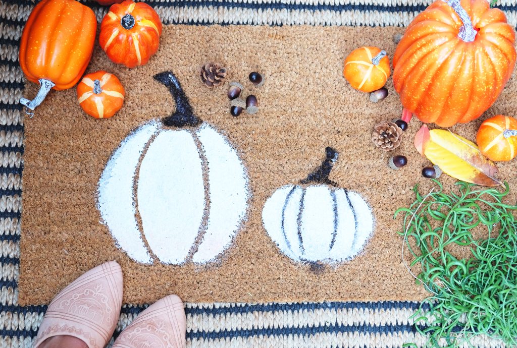 Customizing an original doormat is an impressive way to decorate this Halloween